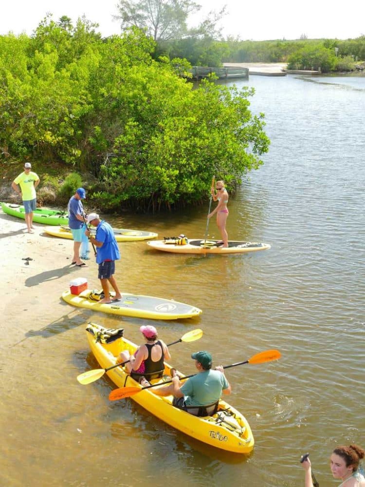 Kayakers and paddleboarders launching along the lagoon at Round Island Park in Vero Beach